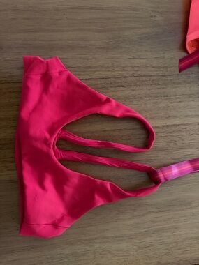 Left of Friday far out swim top sweet chili color